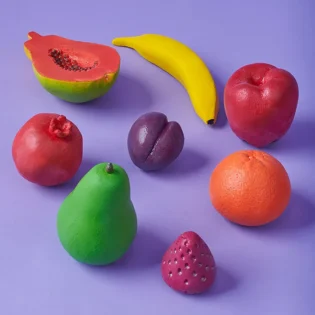 Refurbished play fruit set showing 8 colorful toy fruits